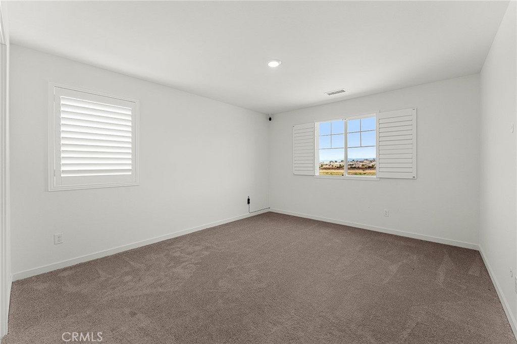 36772 Arietta Way Beaumont, CA 92223 - Photo 30 of 45 an empty room with a window