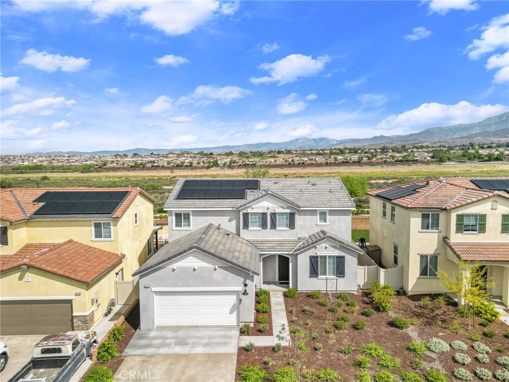 36772 Arietta Way Beaumont, CA 92223 - Photo 3 of 45 a view of a white house with a ocean view