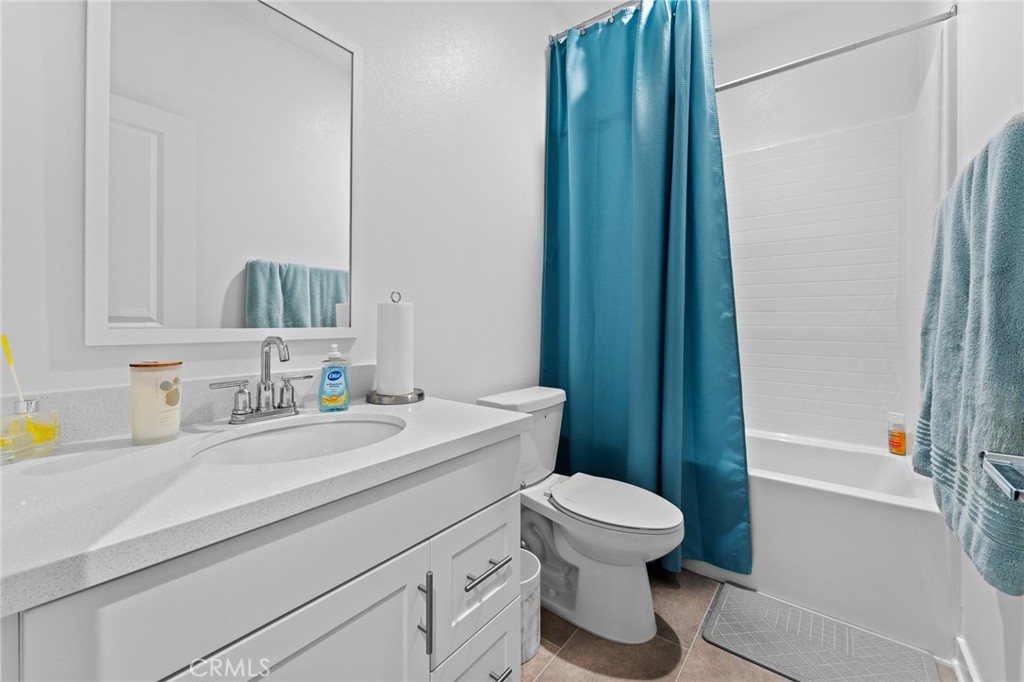 36772 Arietta Way Beaumont, CA 92223 - Photo 32 of 45 a bathroom with a sink a toilet and shower