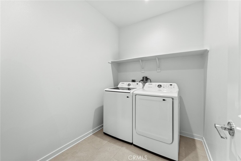 36772 Arietta Way Beaumont, CA 92223 - Photo 34 of 45 a utility room with dryer and washer