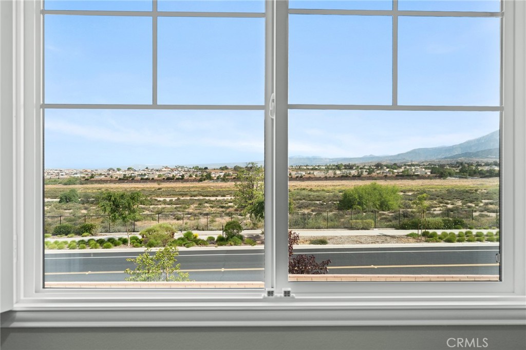 36772 Arietta Way Beaumont, CA 92223 - Photo 36 of 45 a view of a glass door with a view of city