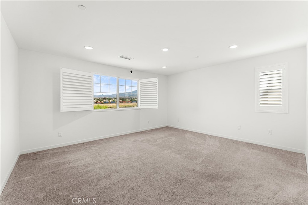 36772 Arietta Way Beaumont, CA 92223 - Photo 39 of 45 an empty room with windows