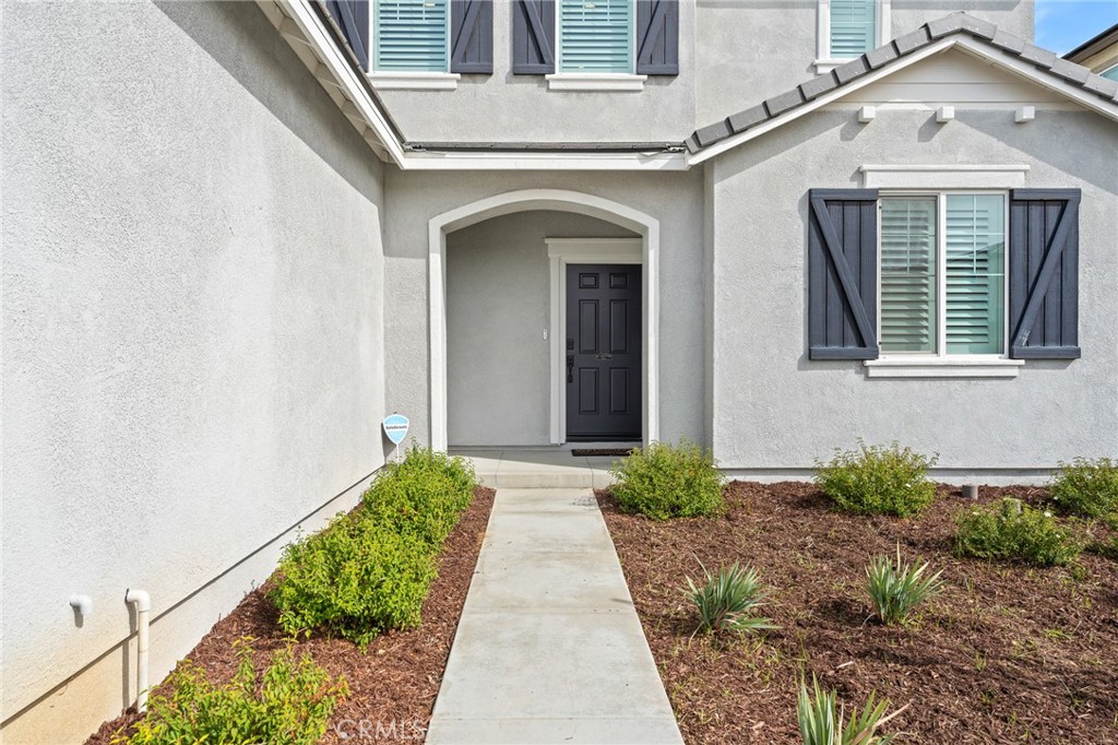 36772 Arietta Way Beaumont, CA 92223 - Photo 7 of 45 a view of a house with potted plants