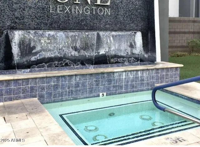 a view of a patio with a dining table and chairs with a fire pit