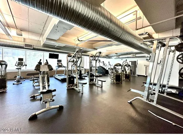 a kitchen with a stove a sink and cabinets