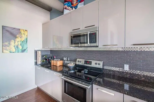 a view of a yard with furniture and tree