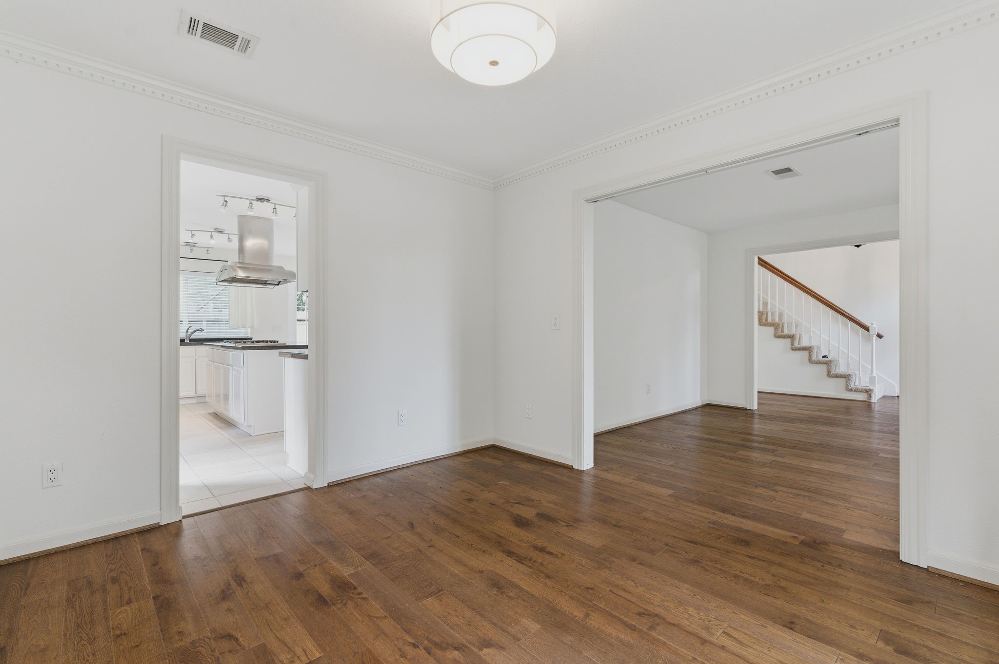59 Fire Flicker Place Spring, TX 77381 - Photo 11 of 37 This inviting space effortlessly transforms into either a formal dining room or a cozy home office, offering versatile elegance and functionality.