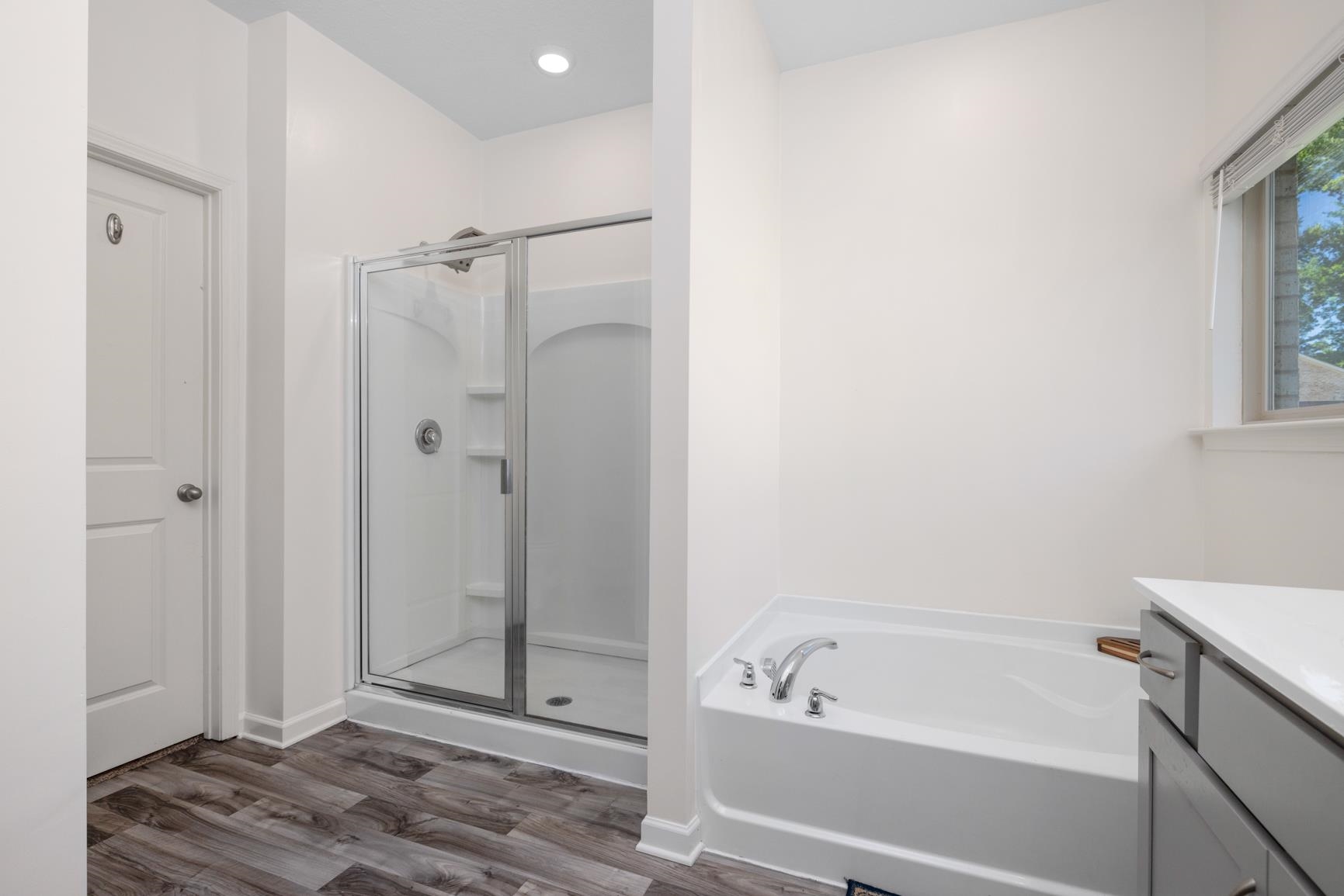 5132 Shellback Drive Millington, TN 38053 - Photo 16 of 24 a bathroom with a bathtub and a shower
