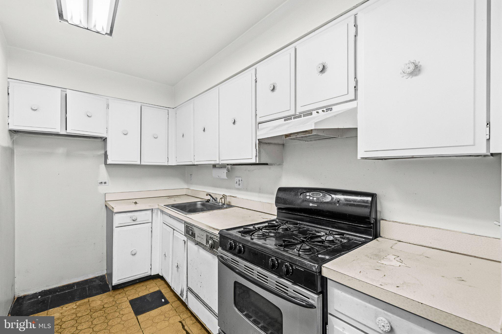 2103 Walsh View Terrace, Unit 102 Silver Spring, MD 20902 - Photo 13 of 30 Bright and functional kitchen space.