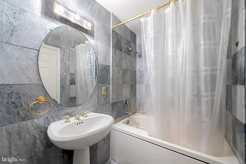 a view of a hallway with washer and dryer