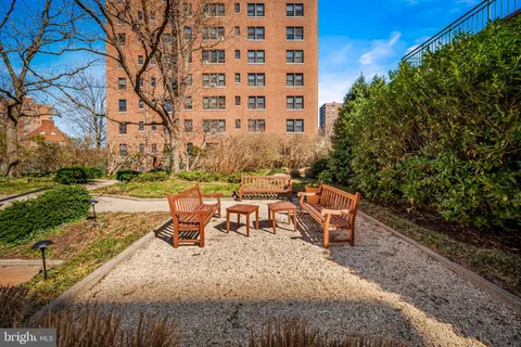 a view of a backyard with sitting area
