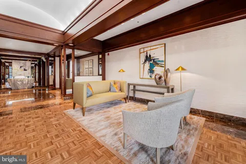 a living room with furniture and a rug