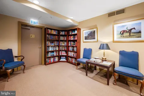 a workspace with furniture and a bookshelf