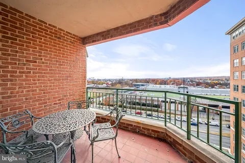 a view of a balcony with a bench