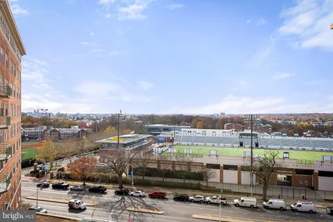 a kitchen with a sink a stove and cabinets