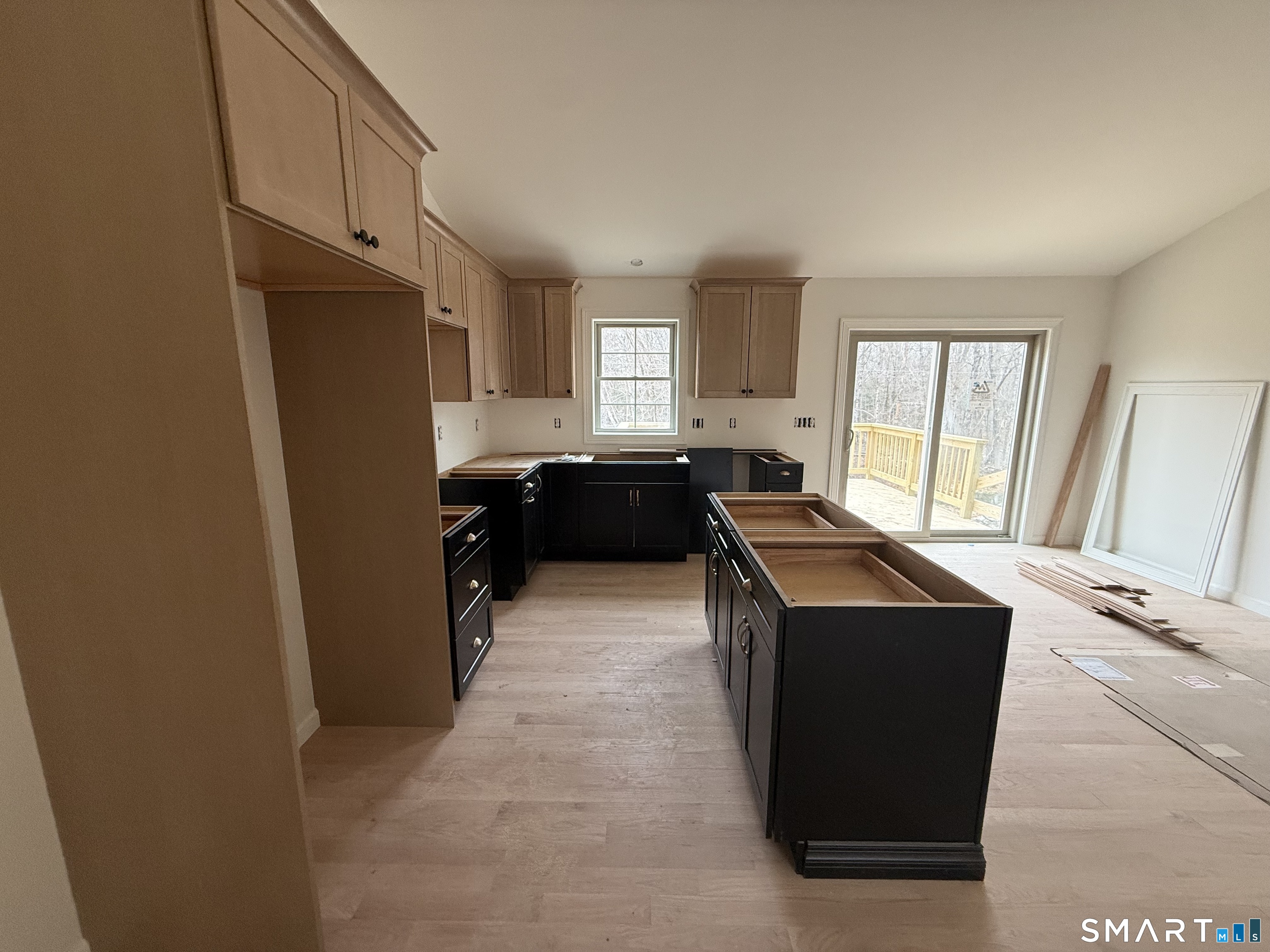 247 Green Hollow Road Killingly, CT 06239 - Photo 14 of 27 a kitchen with a refrigerator a sink a stove and a window