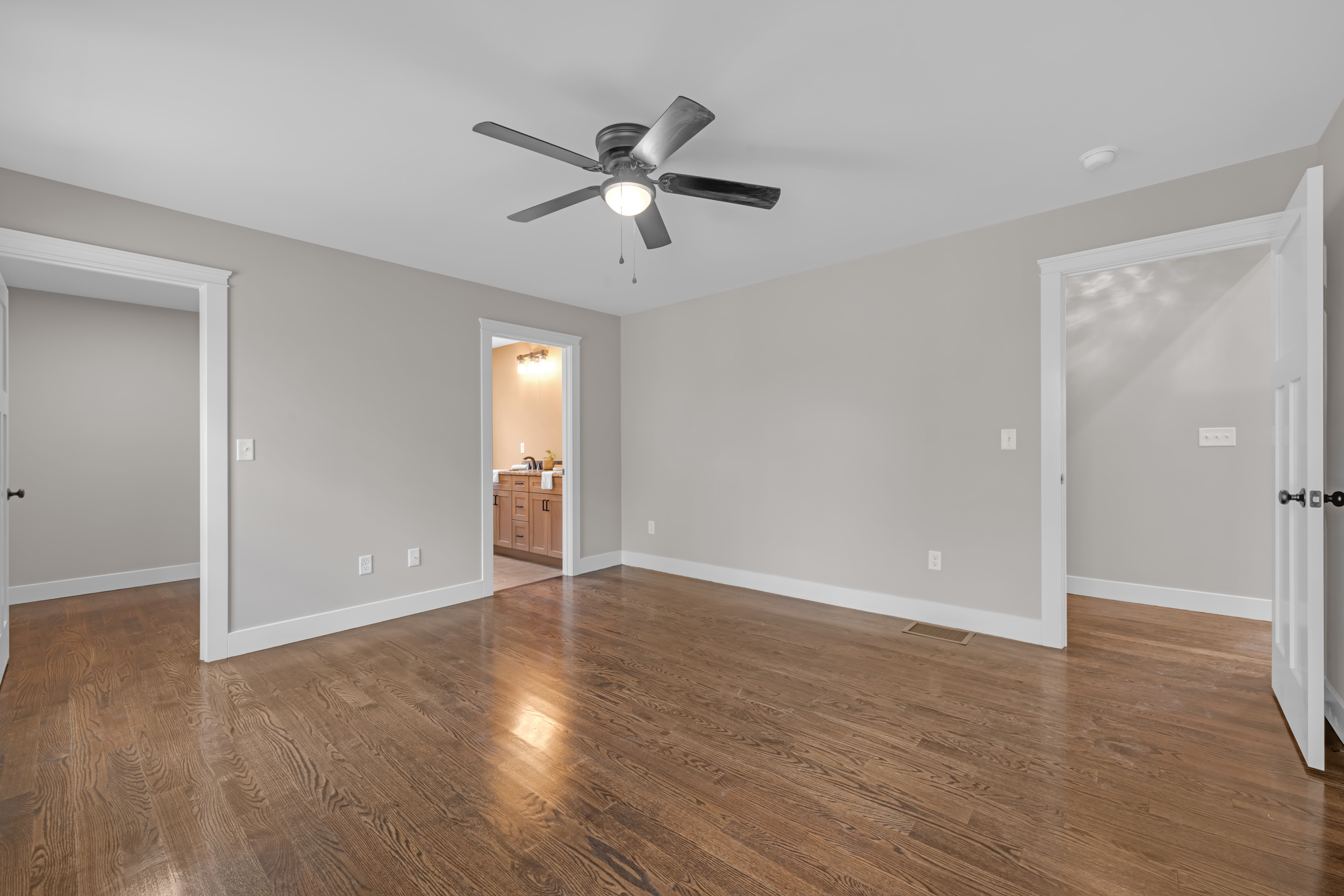 247 Green Hollow Road Killingly, CT 06239 - Photo 17 of 27 a view of an empty room with wooden floor and a ceiling fan