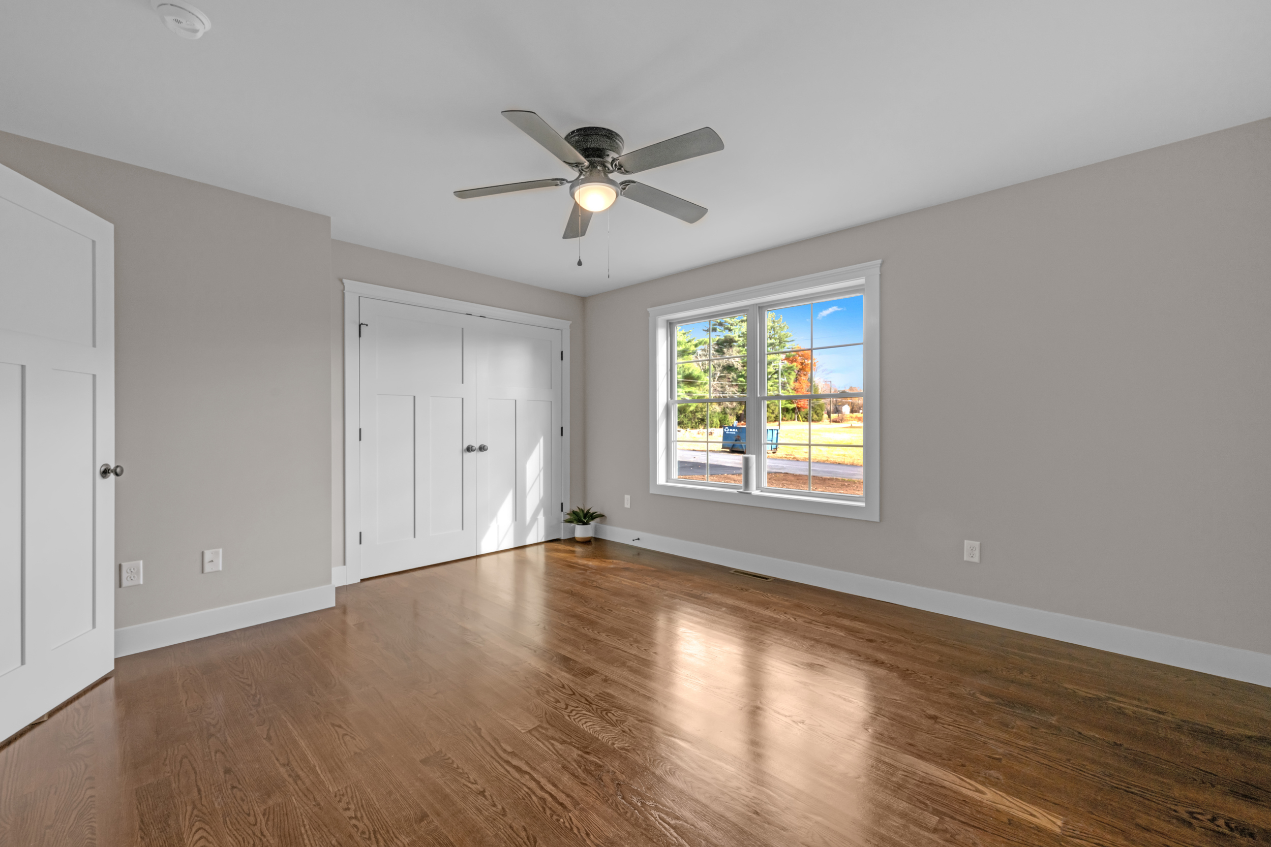 247 Green Hollow Road Killingly, CT 06239 - Photo 21 of 27 a view of an empty room with wooden floor and a window
