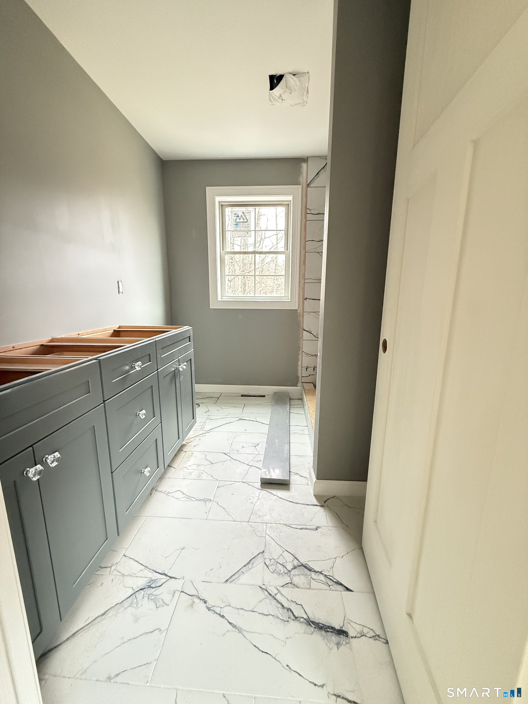 247 Green Hollow Road Killingly, CT 06239 - Photo 24 of 27 a bathroom with a sink a toilet and a vanity