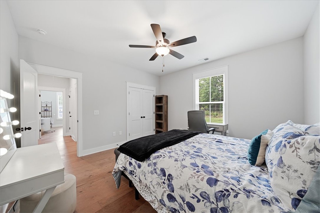 214 Timothy Court Anderson, SC 29621 - Photo 21 of 43 Hardwood floors and a ceiling fan create a comfortable atmosphere in this well-lit room.