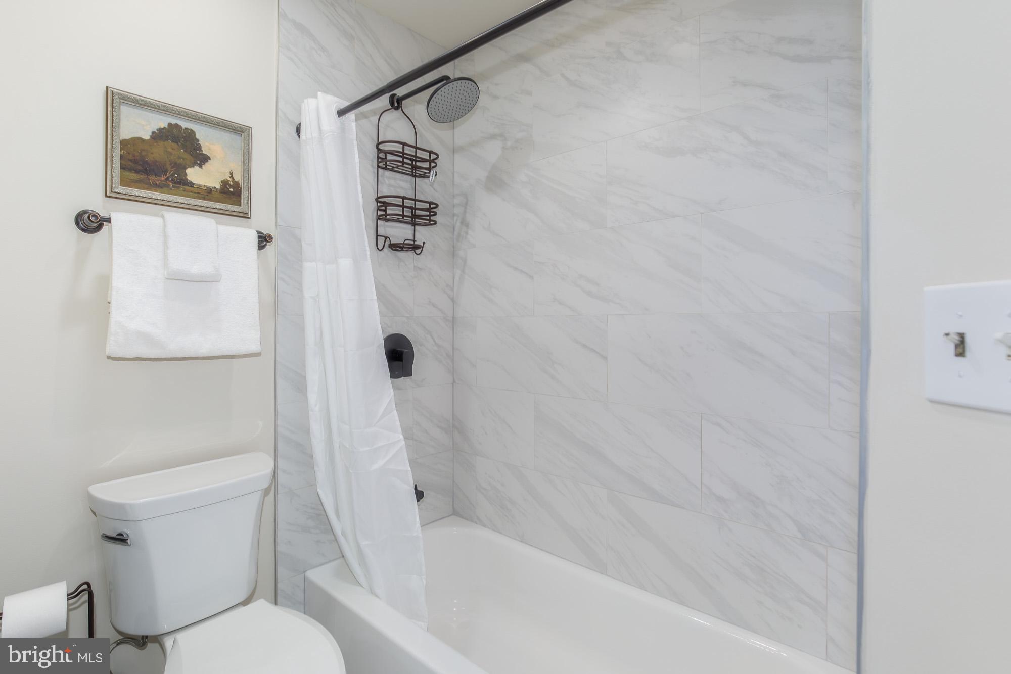 815 G Street Southwest Washington, DC 20024 - Photo 16 of 32 Elegant marble bath retreat.