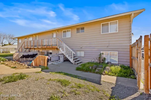 a backyard of a house with seating space