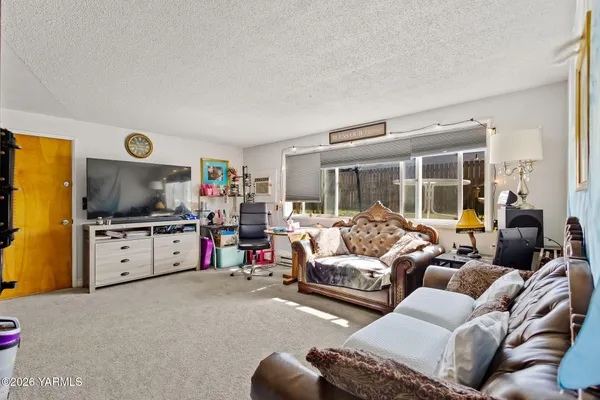 a bathroom with a sink vanity mirror and toilet