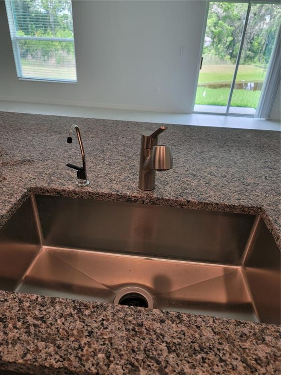 1844 Red Loop Lakeland, FL 33801 - Photo 9 of 24 a view of kitchen sink window and kitchen