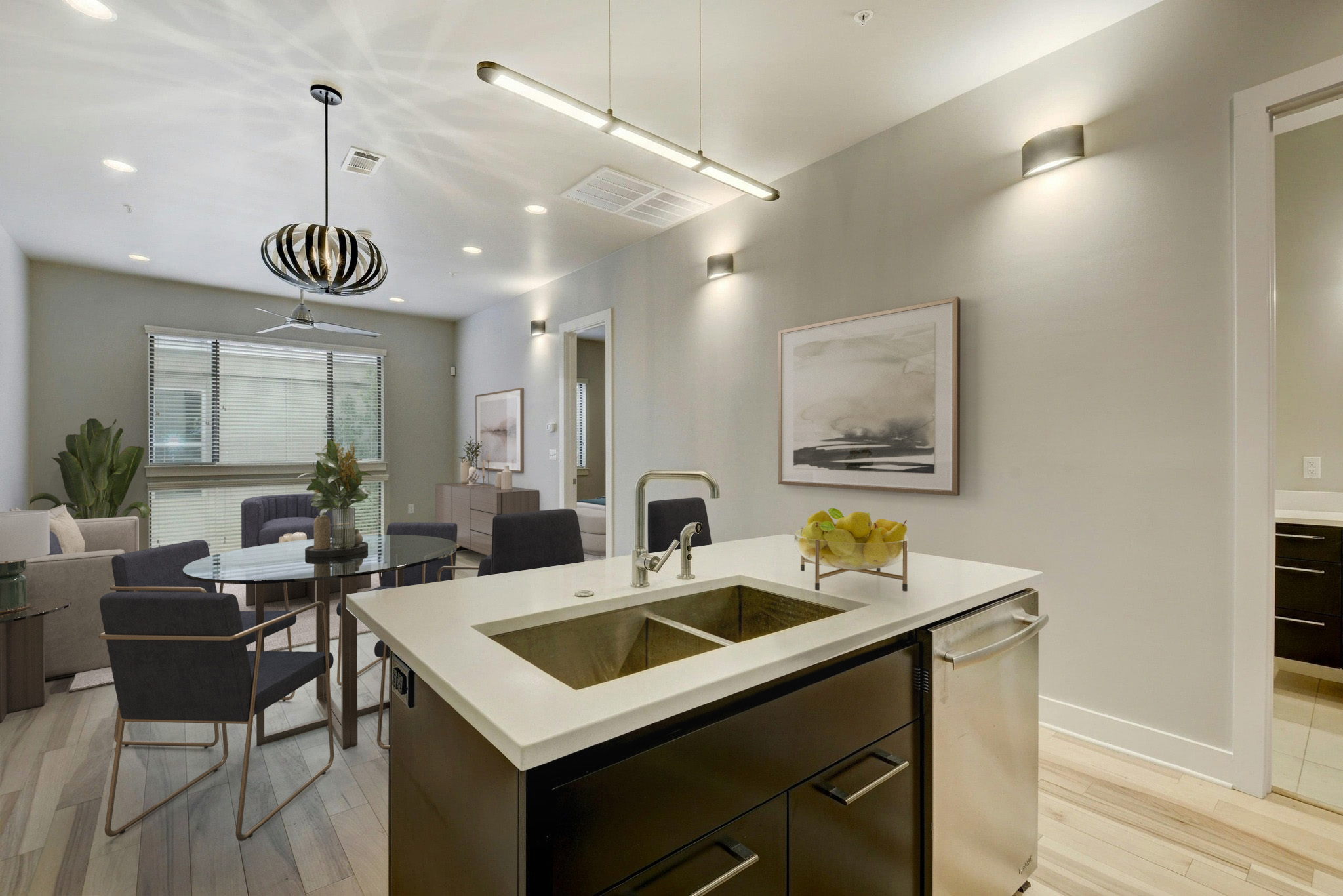 2314 Enfield Road, Unit 202 Austin, TX 78703 - Photo 7 of 20 A well-lit kitchen island offers seamless flow into the adjacent dining area and living space.