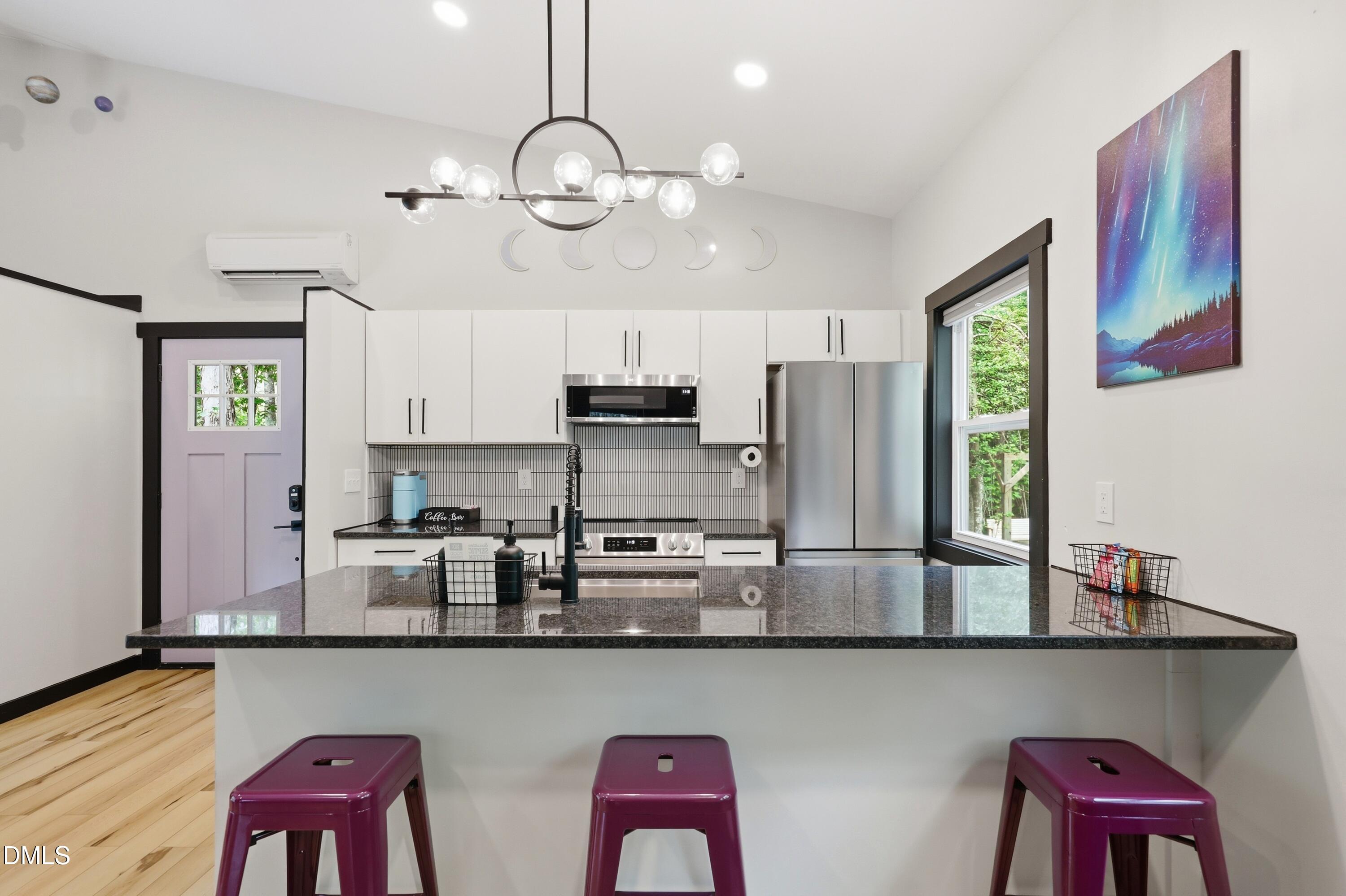 286 Stone Wall Road Pittsboro, NC 27312 - Photo 46 of 71 a view of kitchen with stainless steel appliances granite countertop furniture and wooden floor
