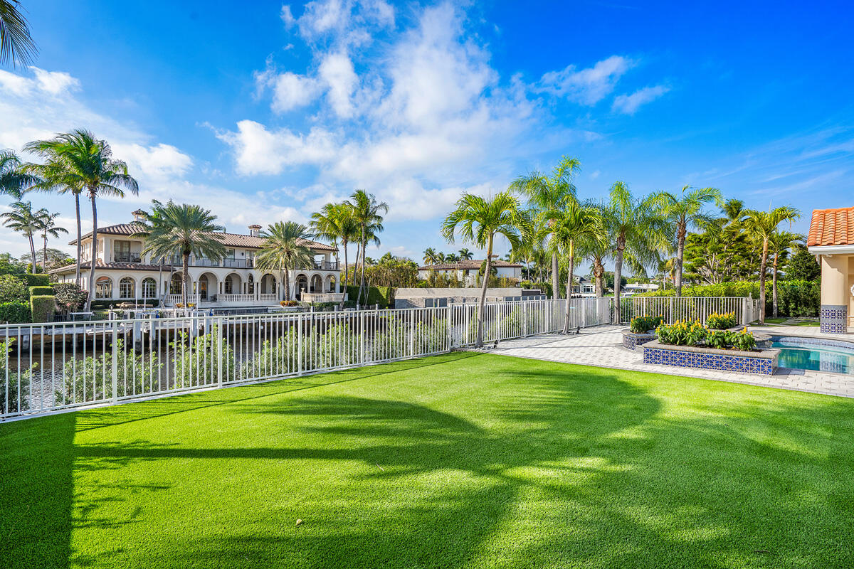 533 East Alexander Palm Road Boca Raton, FL 33432 - Photo 10 of 44 a view of swimming pool with a garden and lake view