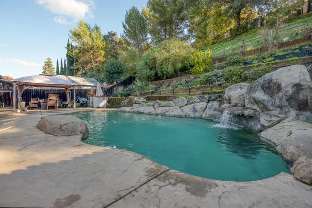 a view of a garden with a patio