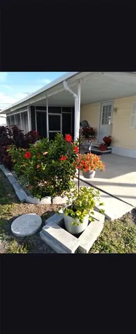 a view of a house with swimming pool and a yard