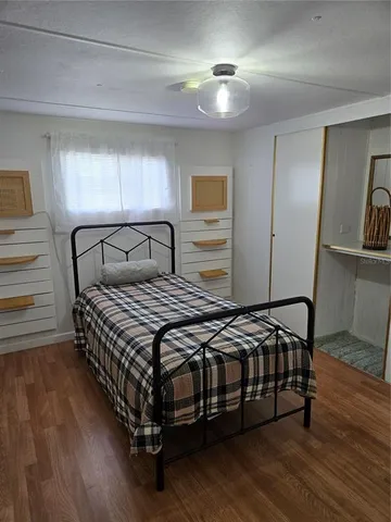 a bedroom with a bed and a cabinets