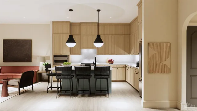 a kitchen with stainless steel appliances kitchen island granite countertop a table chairs and a refrigerator