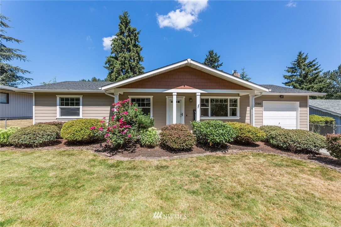 17810 Southeast 121st Place Renton, WA 98059 - Photo 1 of 23 a front view of a house with a yard