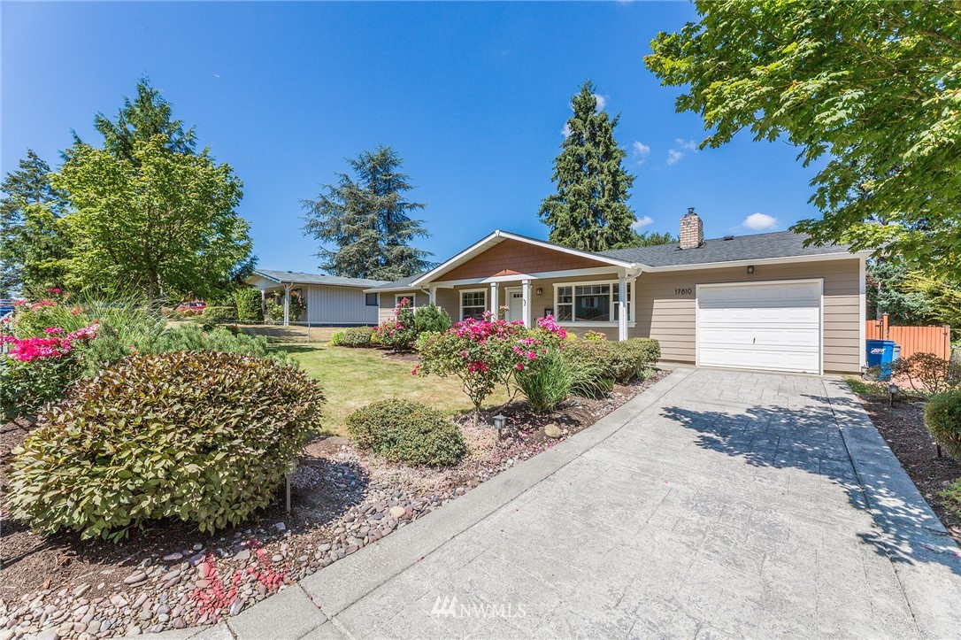 17810 Southeast 121st Place Renton, WA 98059 - Photo 2 of 23 a front view of a house with a yard