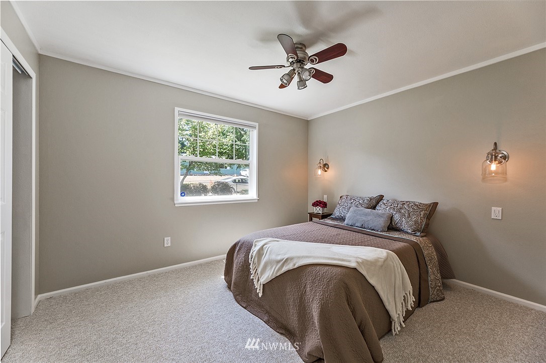 17810 Southeast 121st Place Renton, WA 98059 - Photo 11 of 23 a bed sitting in a bedroom next to a window