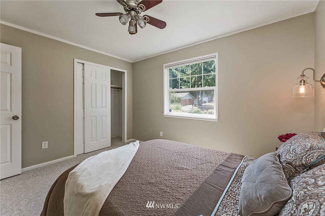 17810 Southeast 121st Place Renton, WA 98059 - Photo 12 of 23 a bedroom with bed and a window