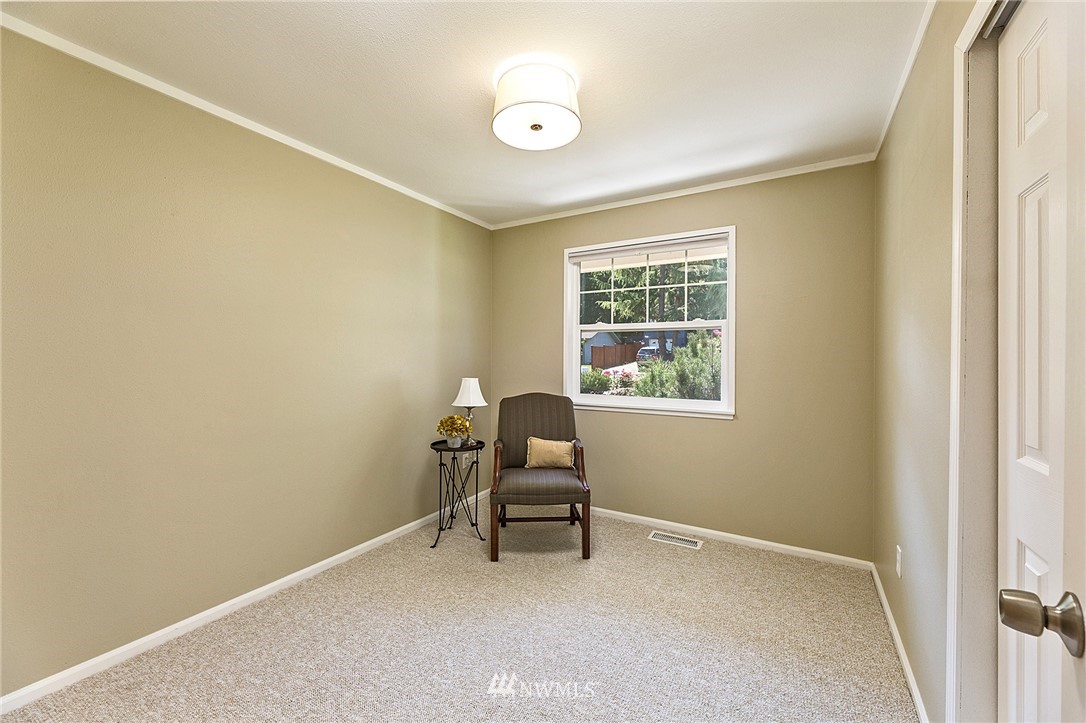 17810 Southeast 121st Place Renton, WA 98059 - Photo 13 of 23 a room with a chair and a window