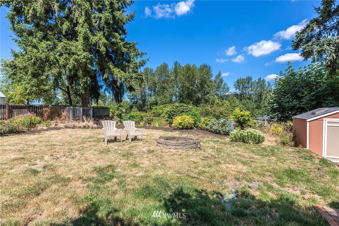 17810 Southeast 121st Place Renton, WA 98059 - Photo 20 of 23 a view of a yard with plants and tree