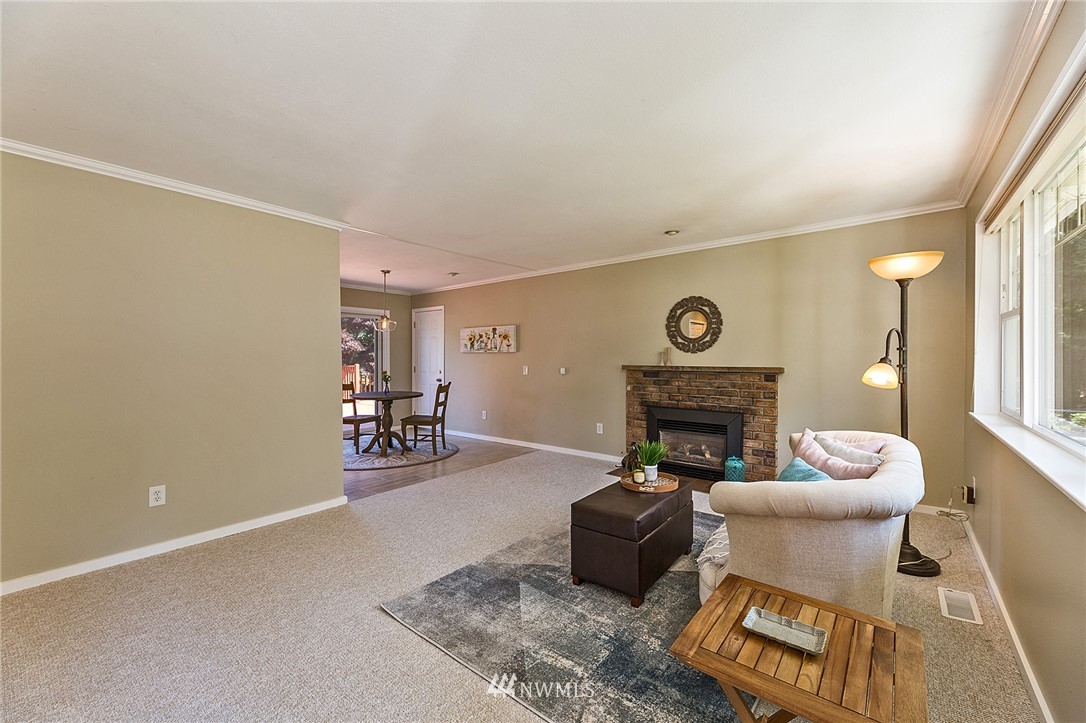 17810 Southeast 121st Place Renton, WA 98059 - Photo 4 of 23 a living room with furniture and a fireplace