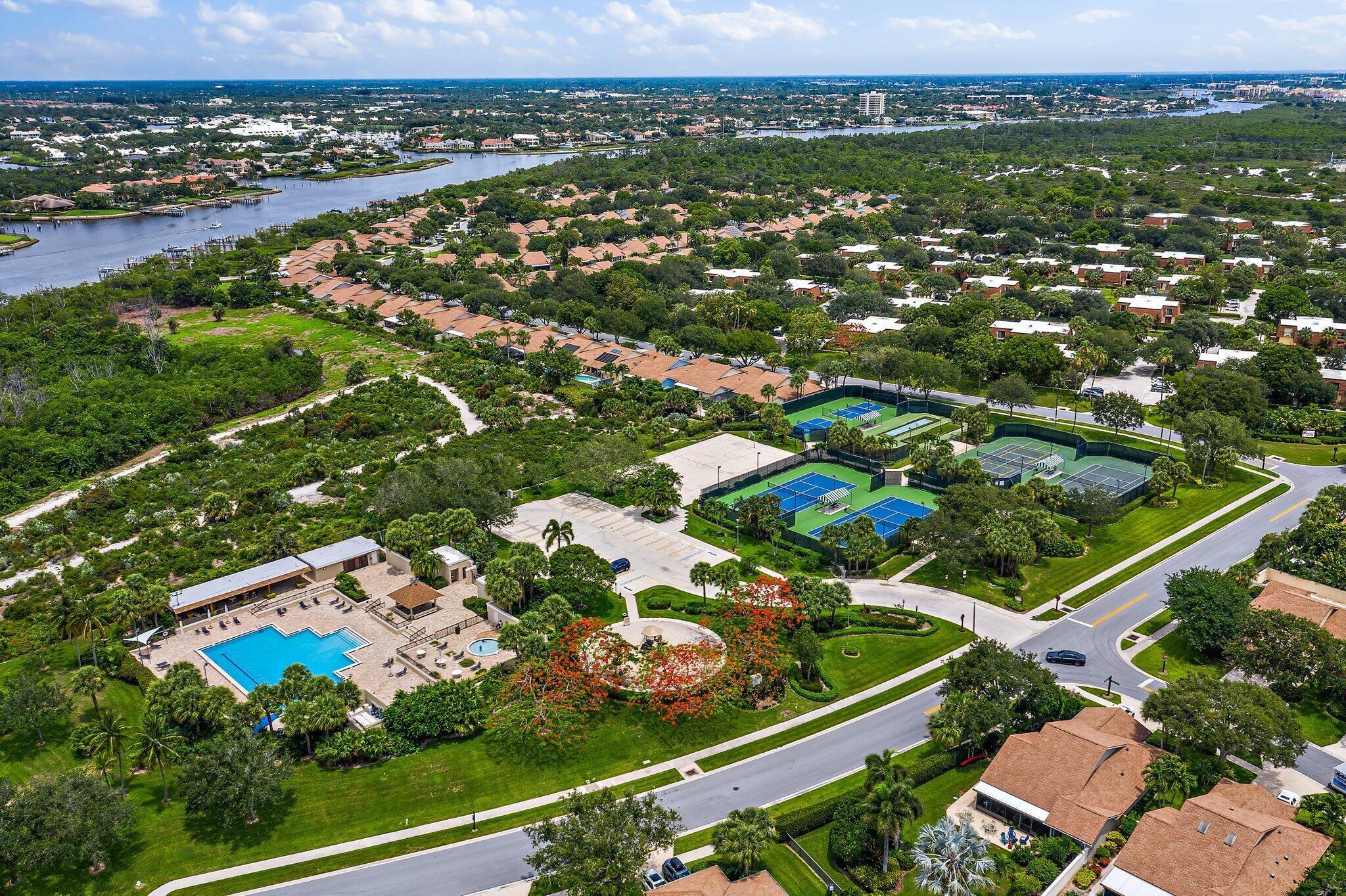 an aerial view of residential houses with outdoor space