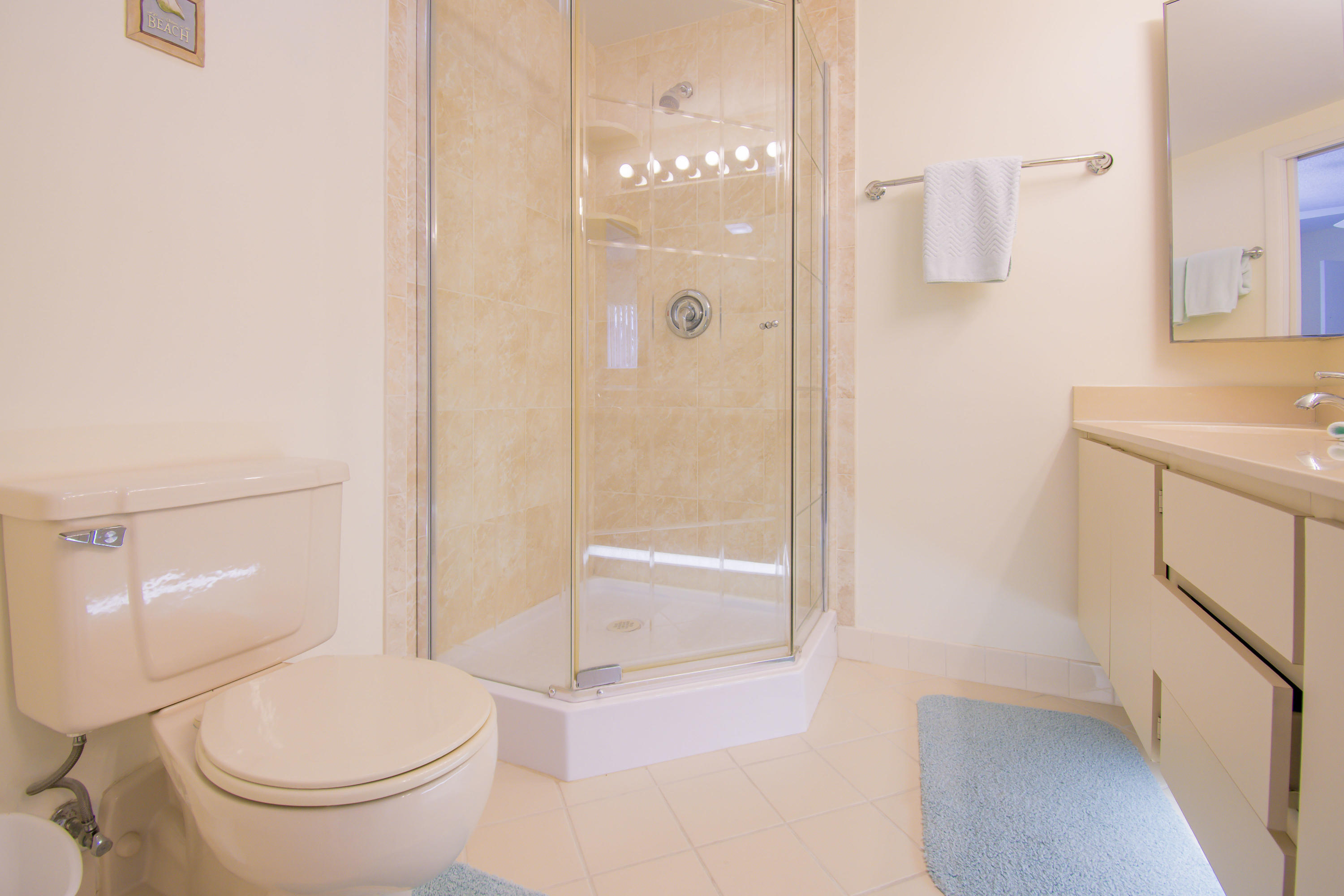 2410 24th Court Jupiter, FL 33477 - Photo 14 of 33 a bathroom with a toilet and a shower