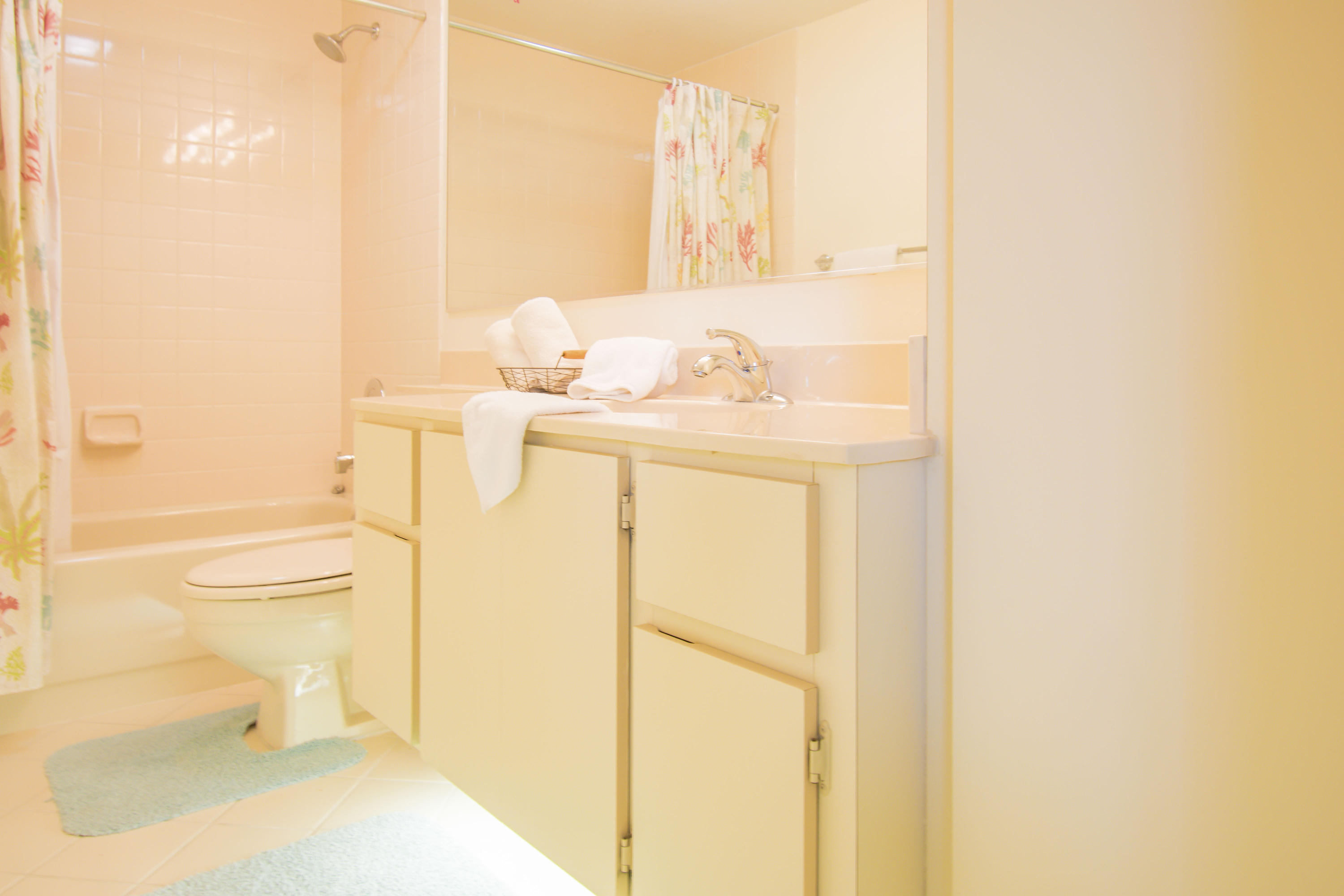 2410 24th Court Jupiter, FL 33477 - Photo 17 of 33 a bathroom with a sink a toilet and shower