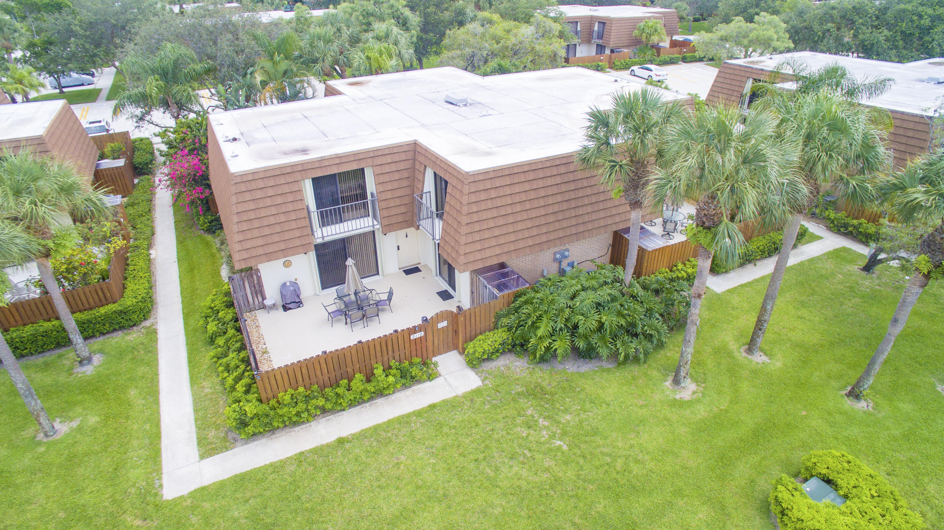 2410 24th Court Jupiter, FL 33477 - Photo 22 of 33 a aerial view of a house with a yard