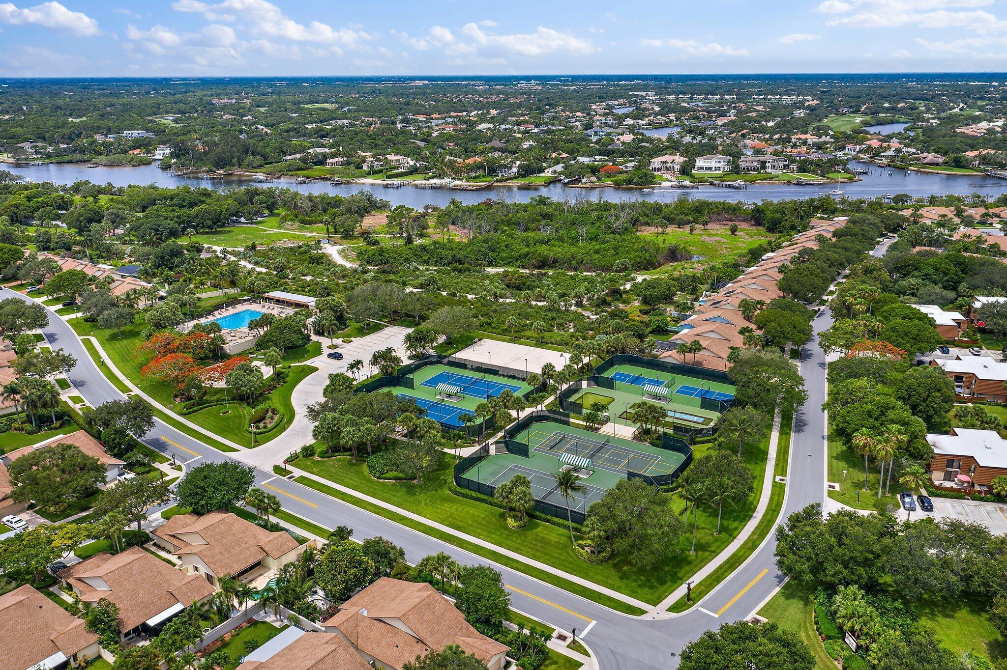 2410 24th Court Jupiter, FL 33477 - Photo 24 of 33 an aerial view of a residential houses with outdoor space