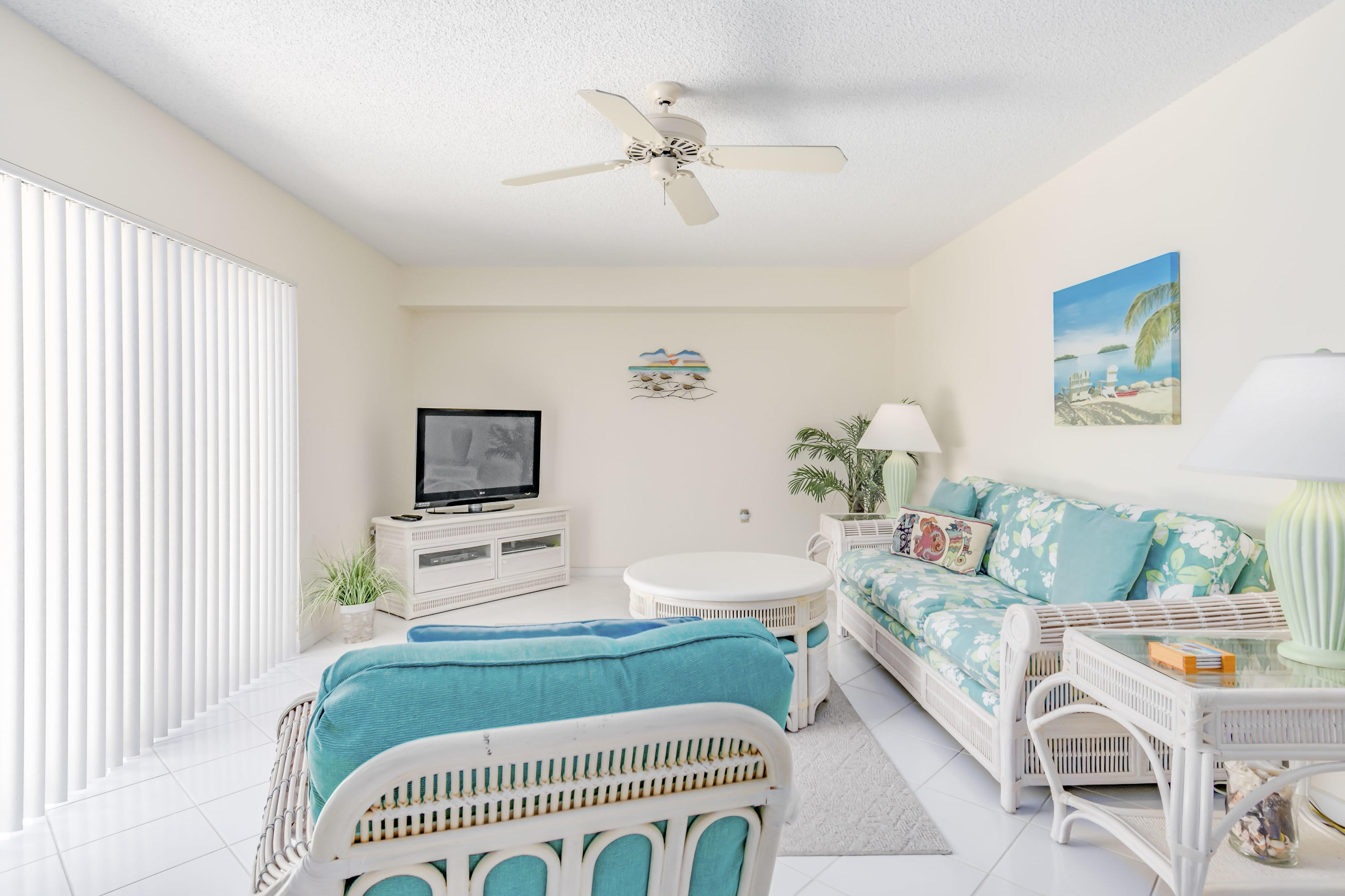 2410 24th Court Jupiter, FL 33477 - Photo 8 of 33 a living room with furniture and a flat screen tv