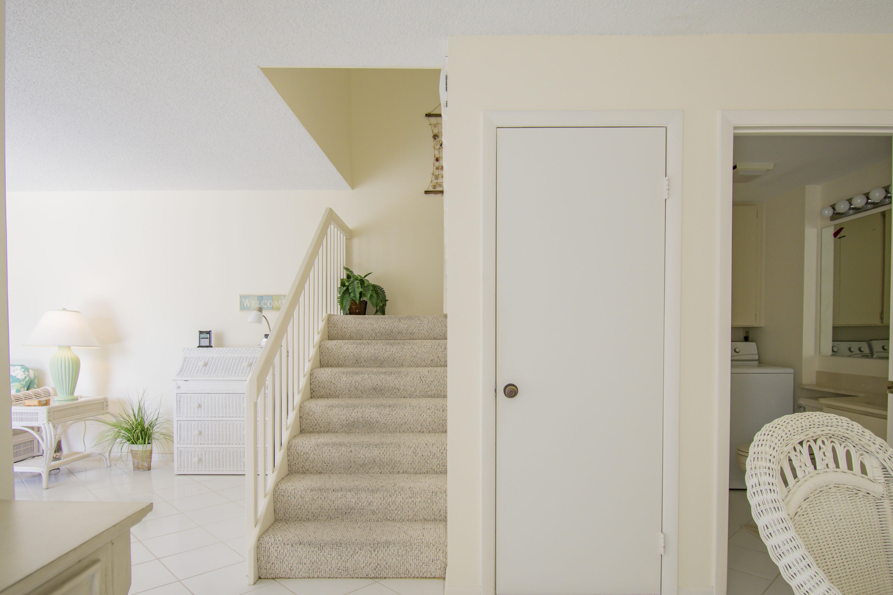 2410 24th Court Jupiter, FL 33477 - Photo 10 of 33 a view of entryway and hall with wooden floor
