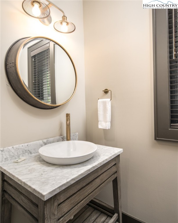 137 Sweetspire Lane Boone, NC 28607 - Photo 11 of 50 a bathroom with a sink and a mirror